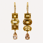Front view of the Almaza earring pair, with assorted golden zircon cuts, pale teardrop ends and diamond-set 18K gold clasps.