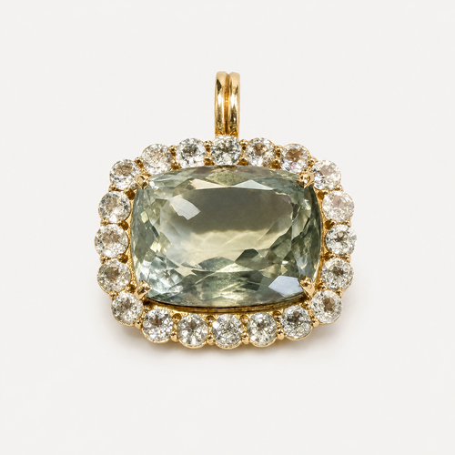 Front view of the Amira pendant: cushion-cut olive green amethyst surrounded by white sapphires in 18K gold.