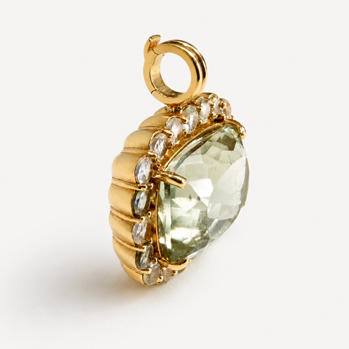 Angled view of the Amira green amethyst pendant, showing its deep 18K gold setting, white sapphire border and hinged bail.