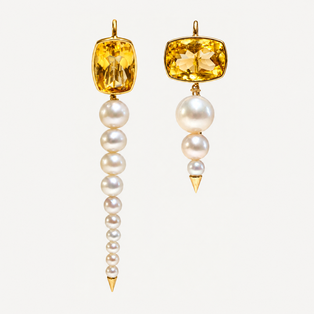 Pair of mismatched Anoud citrine and graduated pearl earrings in 18K gold, in long and short lengths.