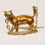 Reverse of the Charlie 18K gold cat pendant, showing its hollow back and chain attached at the head and raised tail.