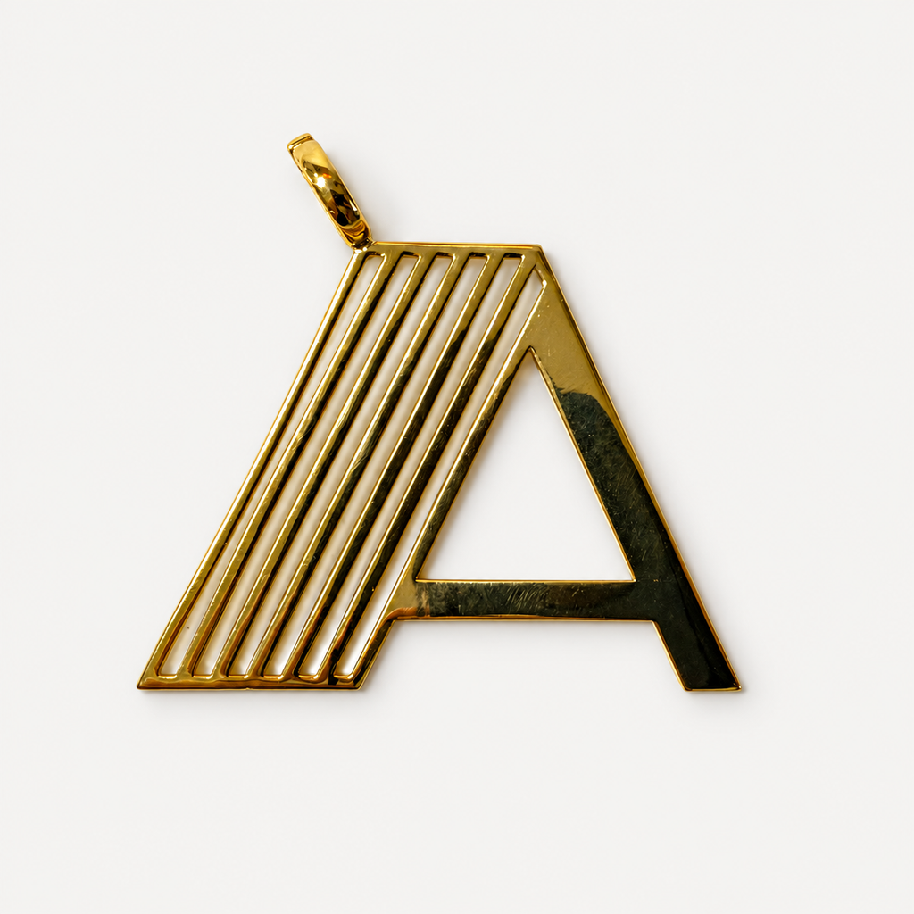 18K gold Deco initial A pendant with open geometric detailing and an offset clasp on a white background.