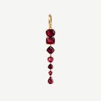 Full-length Dominique earring with seven red garnets in assorted cuts linked beneath a small 18K gold hoop.
