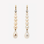 Pair of Farah earrings with white sapphires, graduated round freshwater pearls and teardrop pearl ends in 18K gold.