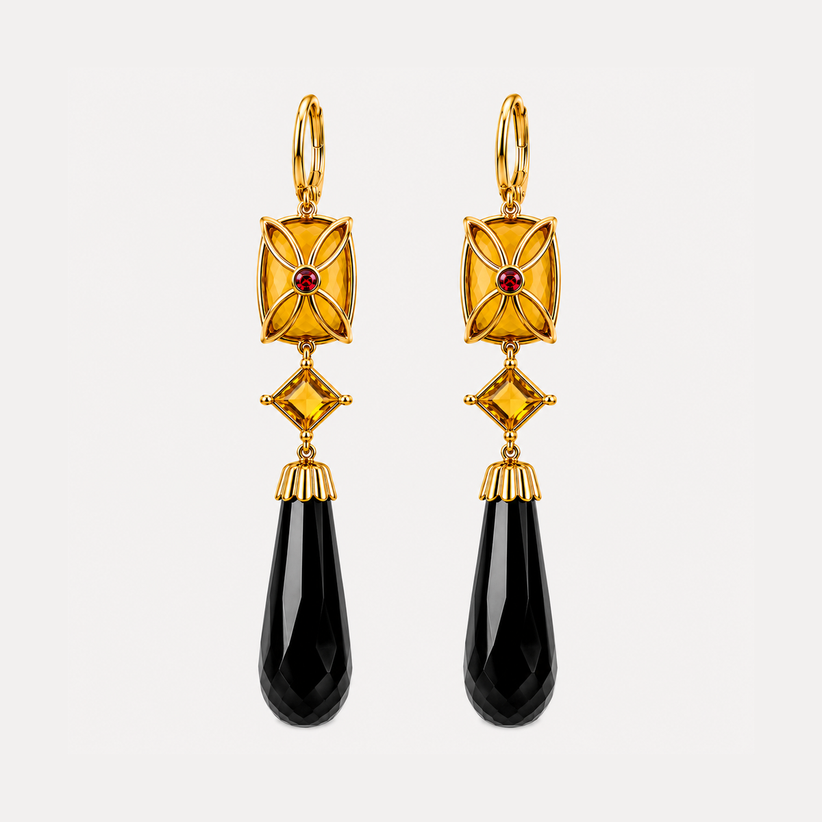 Back of the Lara citrine and black onyx earrings, showing gold floral detailing with small red accents behind the rectangular stones.