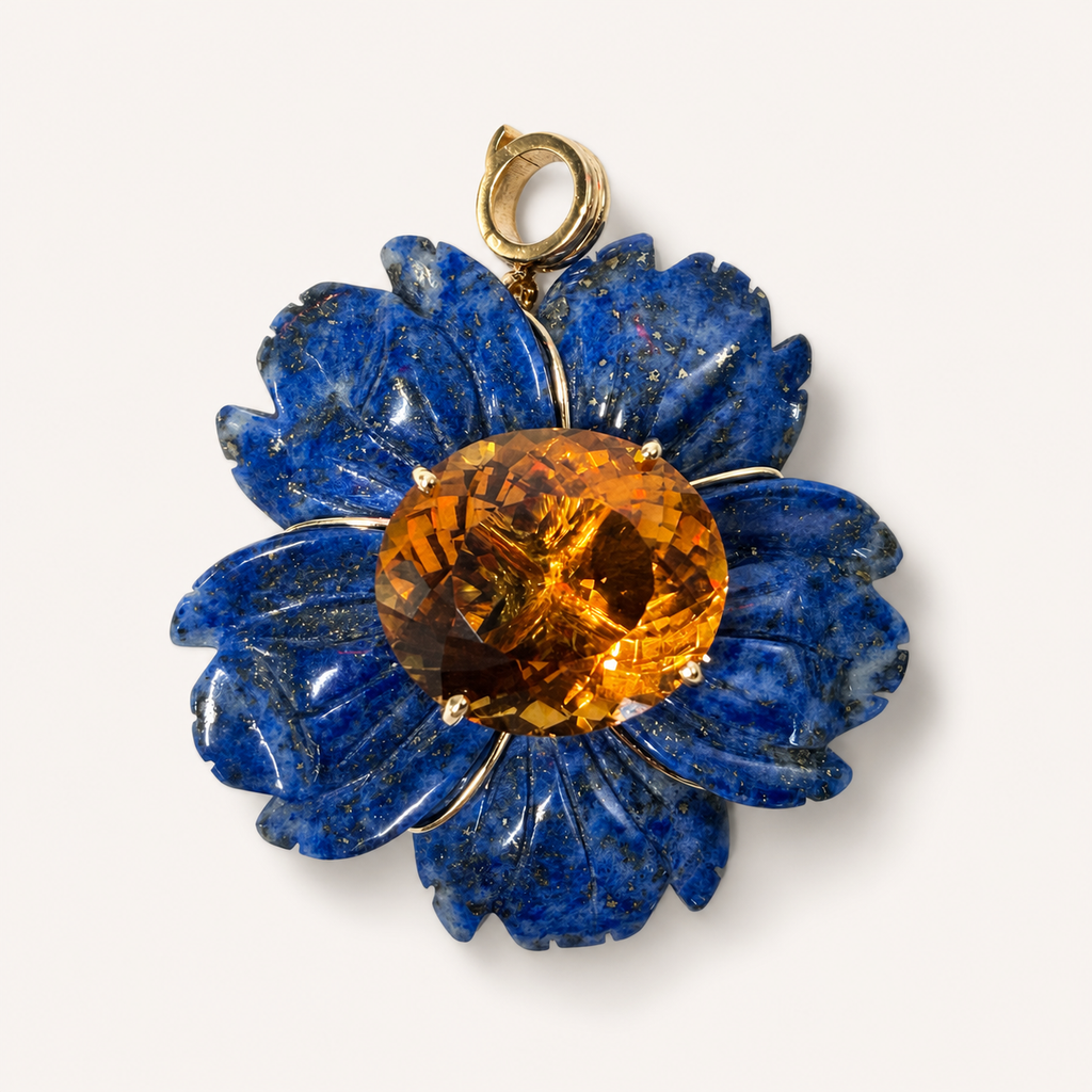 Front view of the Margo pendant, with carved blue lapis lazuli petals, a round golden citrine centre and an 18K gold bail.