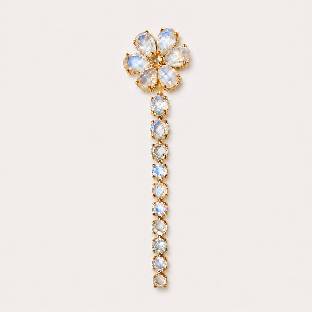 Full-length front view of the Nayla 18K gold earring, with a rainbow moonstone flower and a long graduated drop of round stones.
