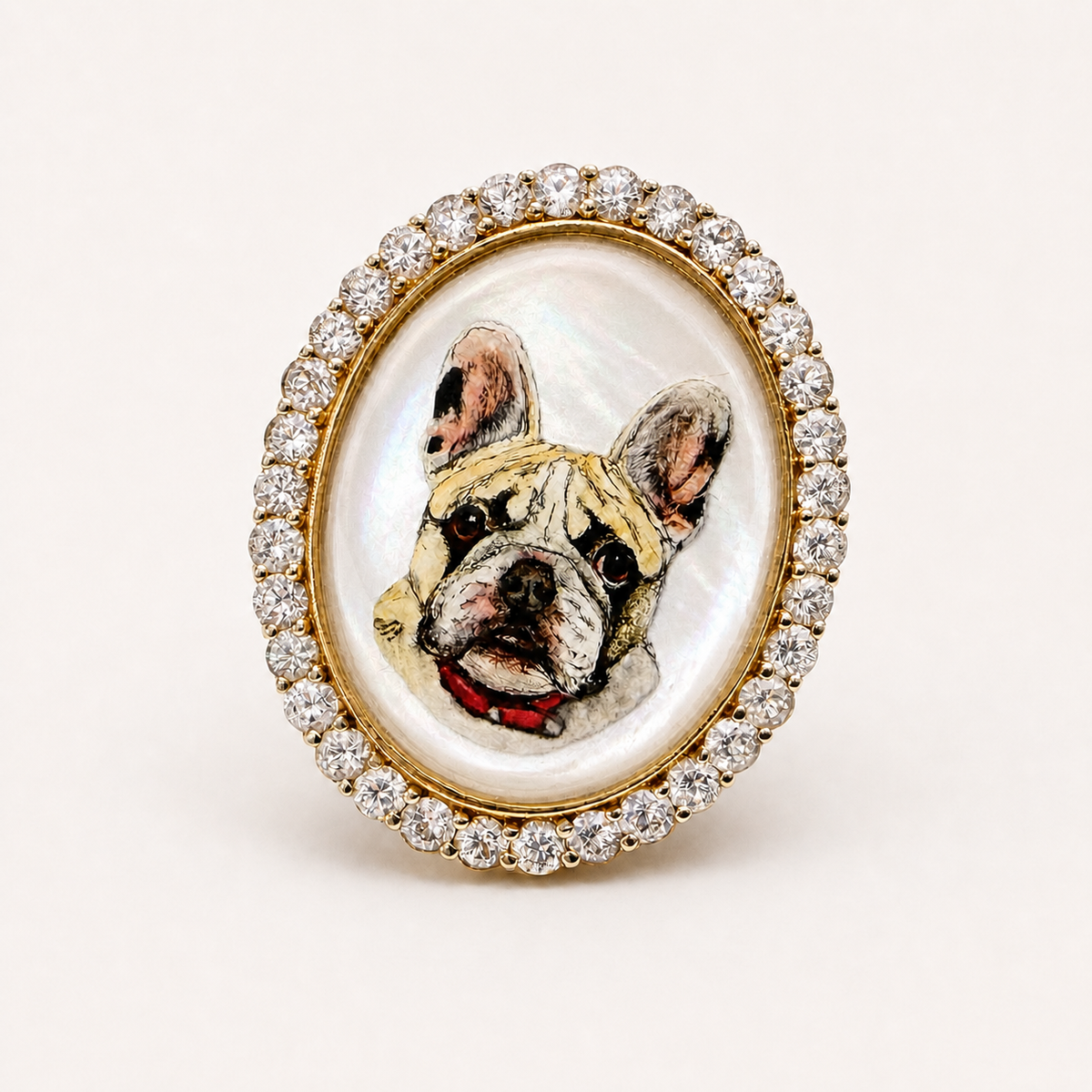 Front view of the pet portrait ring, featuring a hand-painted French bulldog with a red collar in rock crystal, framed by clear gemstones.