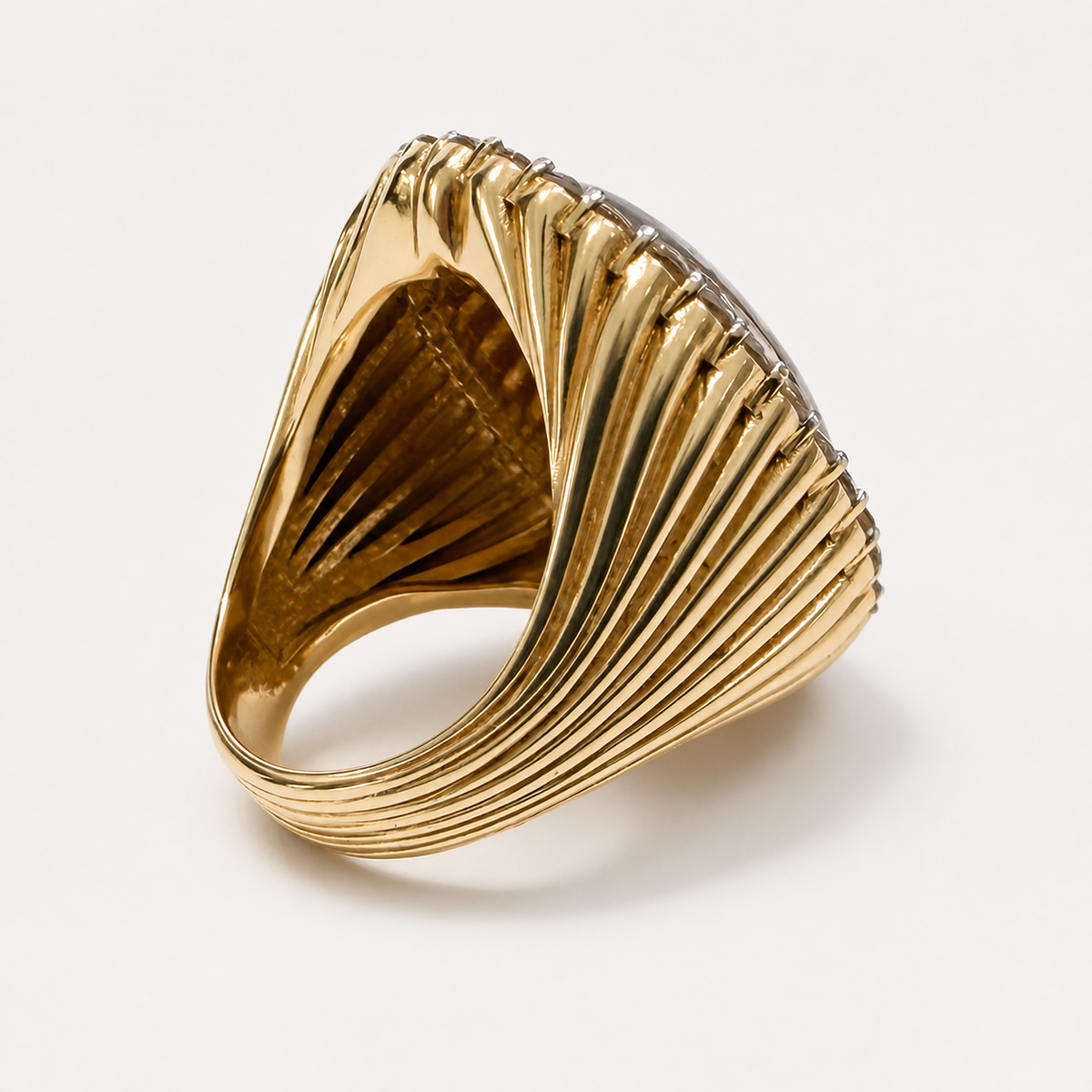 Back of the pet portrait ring, showing the open underside and radiating fluted pattern of the 18K gold band.