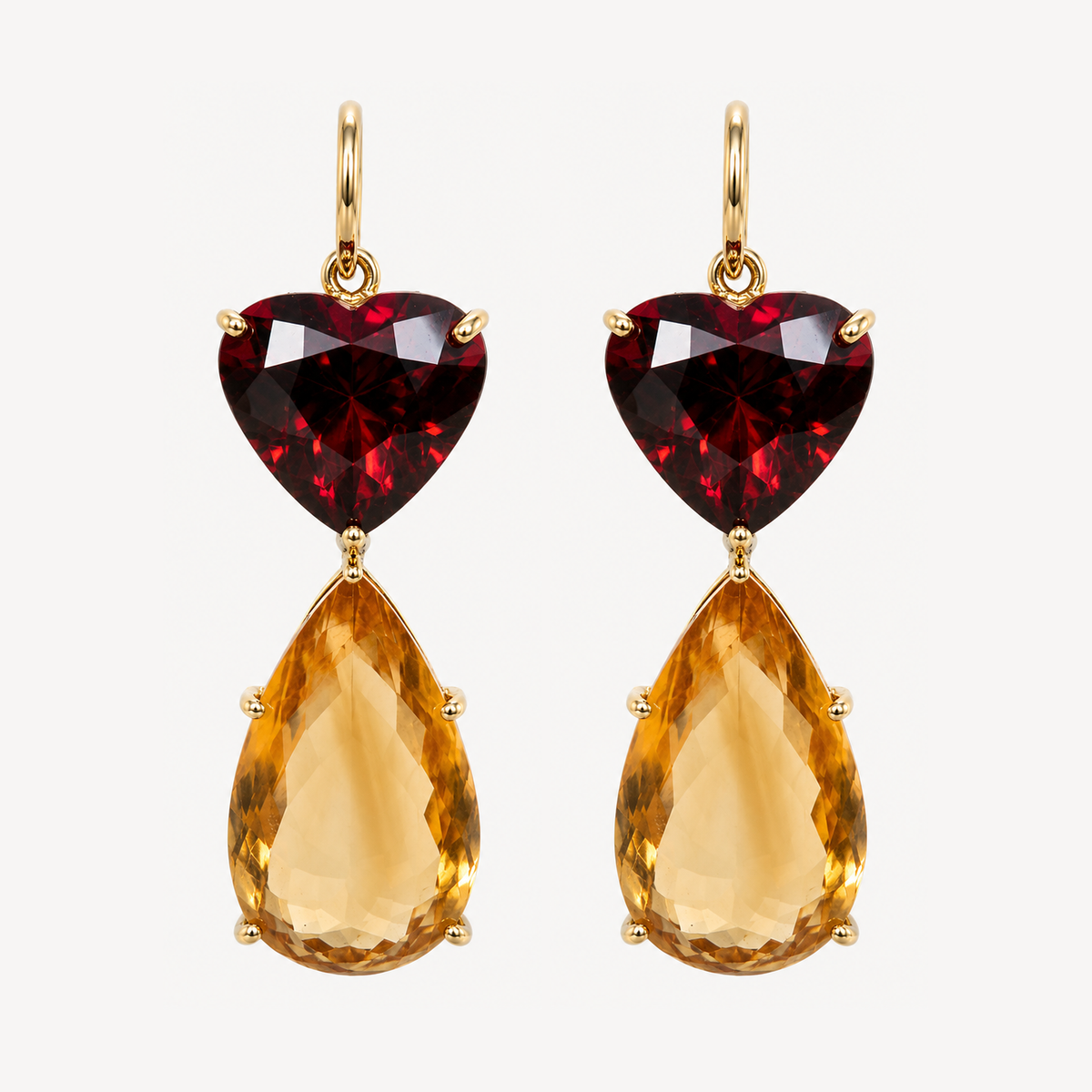 Pair of Roubini 18K gold earrings with heart-shaped red garnets and large pear-shaped golden citrine drops.