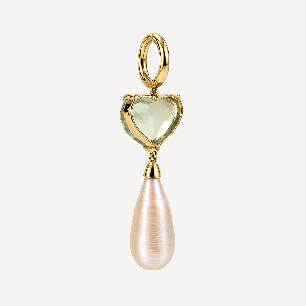 Back of a Sandy earring, showing the open gold heart-shaped gemstone setting, hinged hoop and freshwater pearl drop.