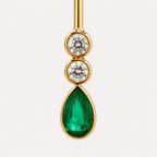 Close-up of the Serena earring gemstones: two round aquamarines above a pear-shaped green emerald, framed in polished 18K gold.