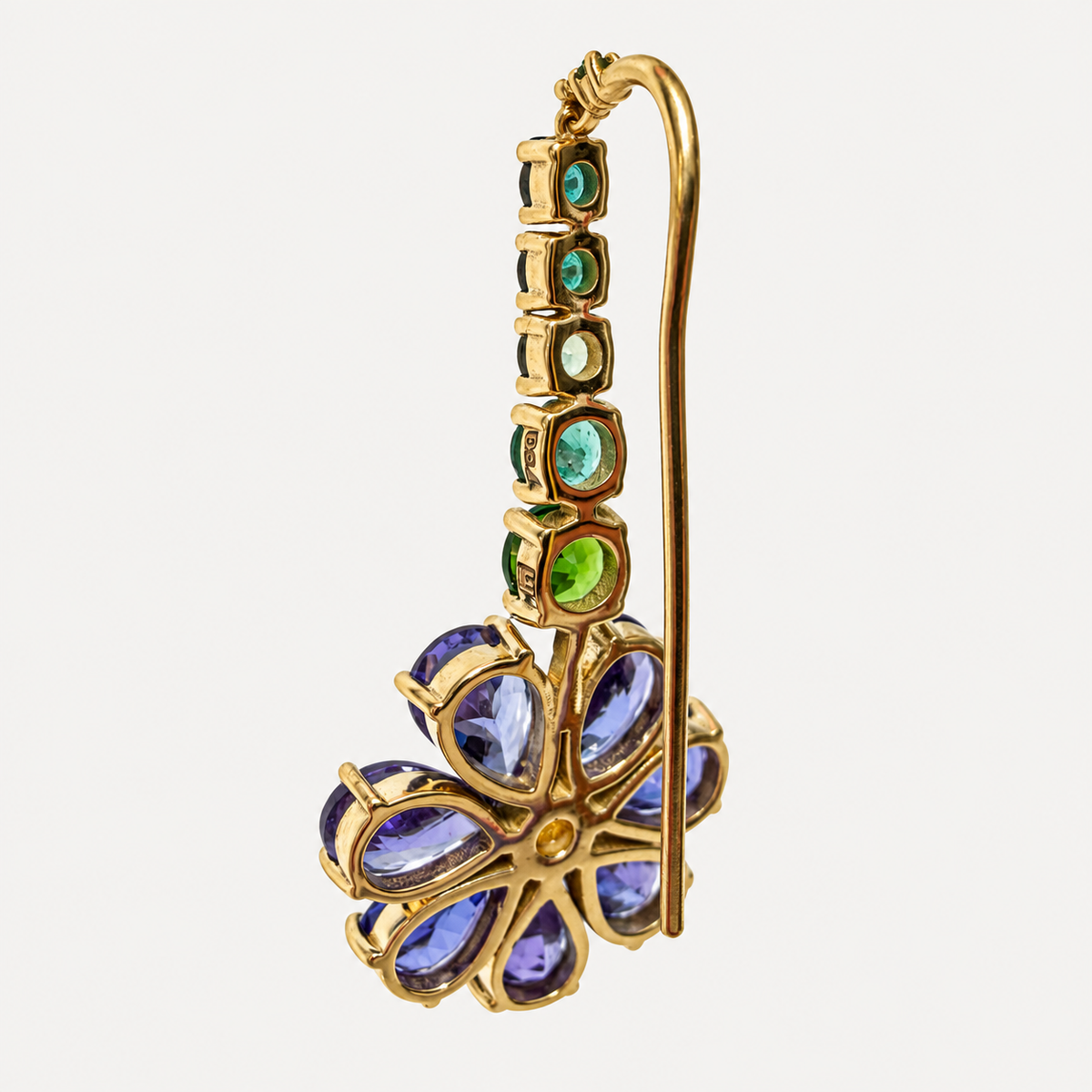 Reverse of the short Violette earring, showing a tanzanite flower, open green gemstone settings and a long gold hook.